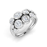 A large lab-grown diamond bubble cluster ring in platinum or white gold, with multiple bezel-set diamonds of various sizes, on a white background.